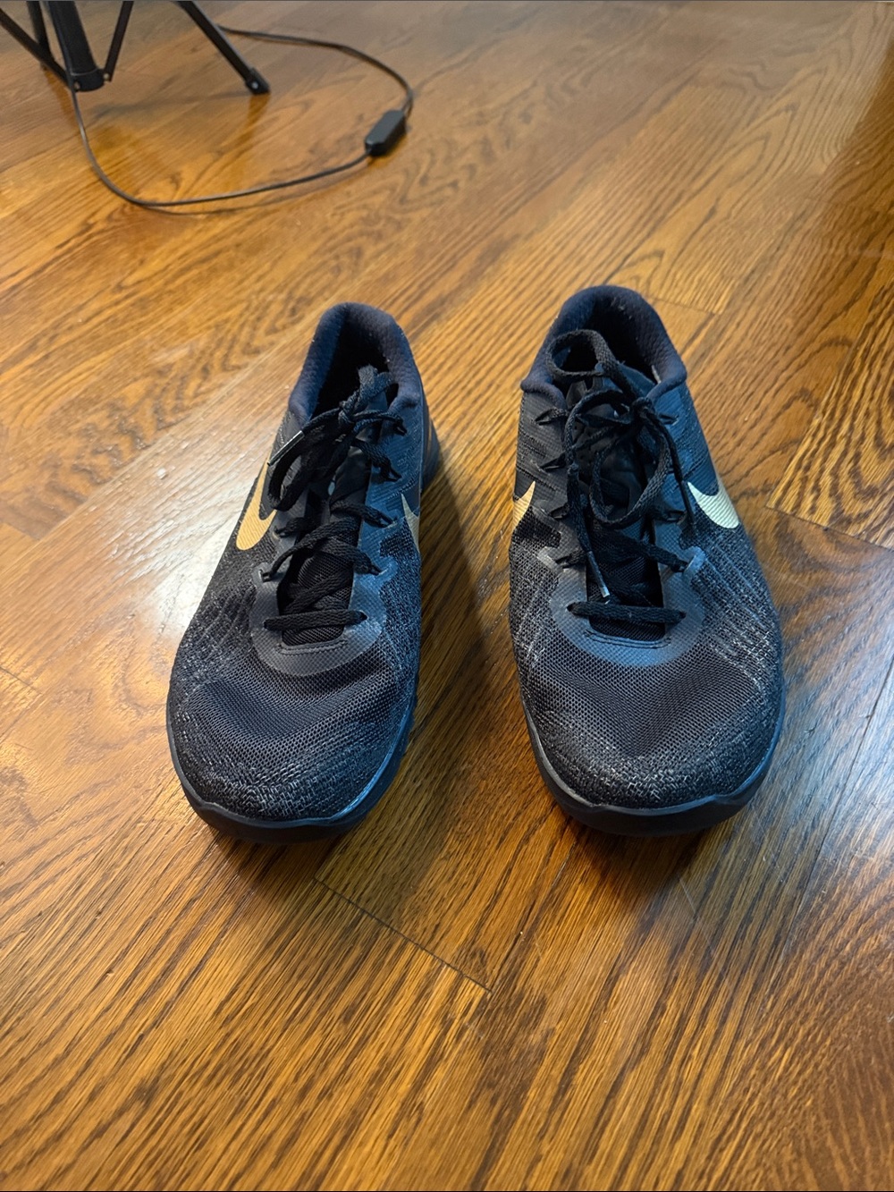 Nike Men’s Black Athletic Shoes with Gold Swoosh